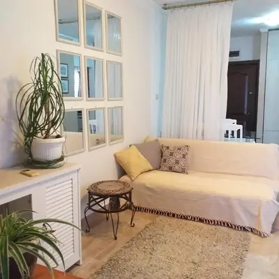 a living room with a couch and a table at Apartment Mika in Budva