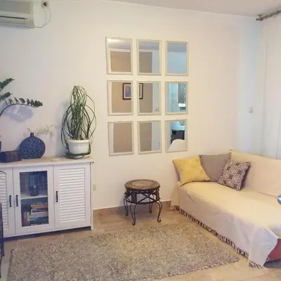 a living room with a couch and a window at Apartment Mika in Budva