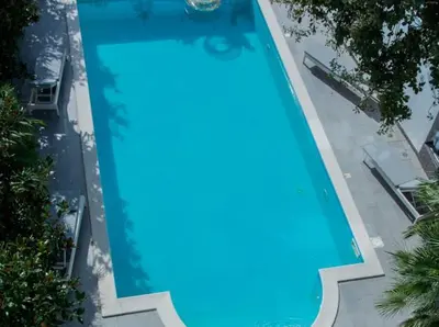 an overhead view of a large blue swimming pool at Lux Villa Ivan Budva in Budva