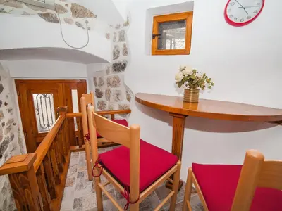 a dining room with a table and chairs at Apartment Alexandra in Kotor
