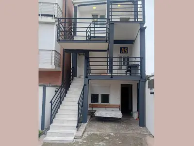an outside view of a building with stairs at AS MONTENEGRO SUITES in Podgorica