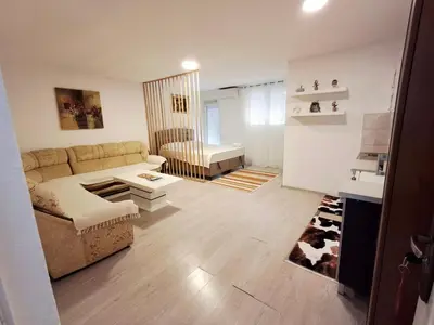 a living room with a couch and a table at AS MONTENEGRO SUITES in Podgorica