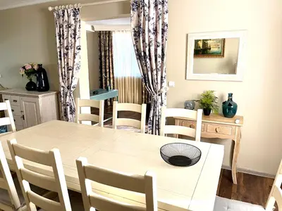 a dining room with a table and chairs at Selena in Bar