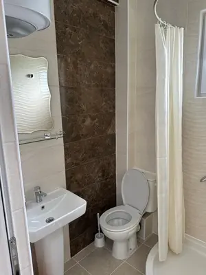 a bathroom with a toilet and a sink at Apartments Flamida in Ulcinj