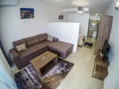 a living room with a couch and a coffee table at Apartments Timoni in Ulcinj