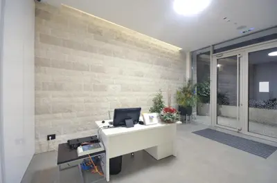an office with a desk with a computer on it at Leona Residences Apartment in Budva
