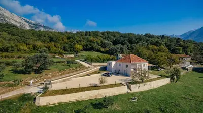 an aerial view of a house in a field at Uphill Glavanovic Villas in Bar