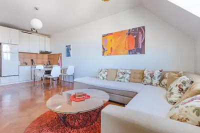 a living room with a couch and a table at Old town Beauty Apartment with great view in Podgorica