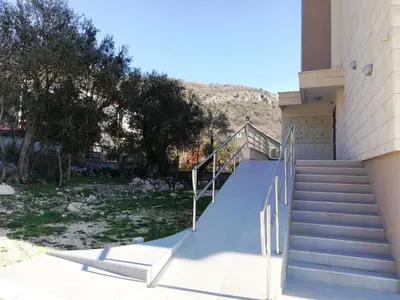 a set of stairs leading to a building at Apartment Olive Montenegro KO Becici in Budva