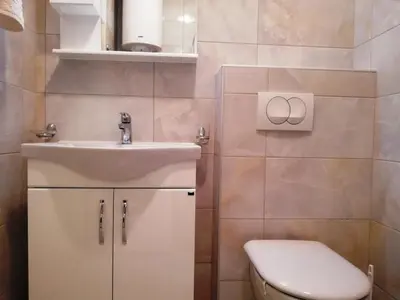 a bathroom with a sink and a toilet at Apartment Olive Montenegro KO Becici in Budva