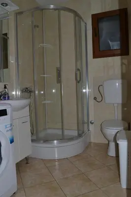 a bathroom with a shower and a toilet at Guest House Radulovic in Petrovac na Moru