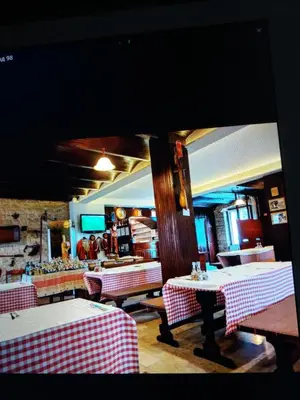 a restaurant with red and white tables and a mirror at BNB Njeguska sijela in Njeguši