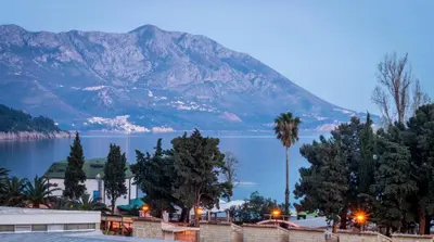 a view of a lake with a mountain in the background at Lux Apartments Kristina in Budva