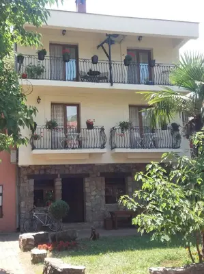 a building with balconies with potted plants on it at Apartment Vukasevic in Virpazar