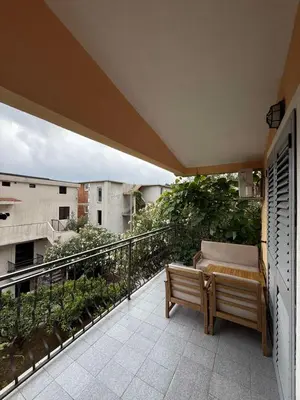 a balcony with a bench on a balconyvisor at Apartment Stana in Petrovac na Moru