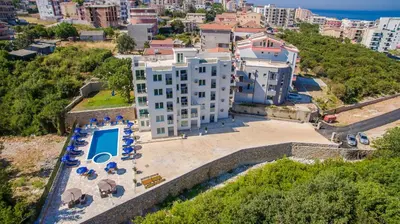 an aerial view of a building with a swimming pool at Adriatic Dreams Apartments in Dobra Voda