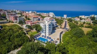 an aerial view of a building with a swimming pool at Adriatic Dreams Apartments in Dobra Voda