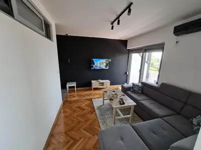 a living room with a couch and a table at Apartment Ralf in Ulcinj