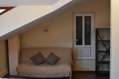 a room with a bed with two pillows on it at Apartments Qualitas in Kotor