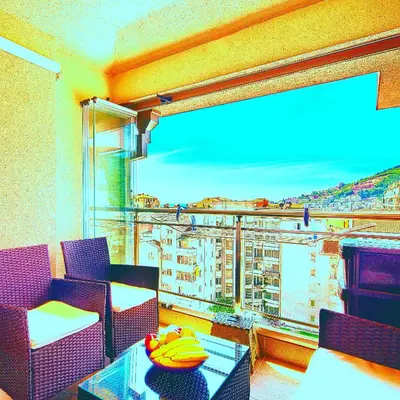 a room with a balcony with a view of a city at Apartment SVS in Budva