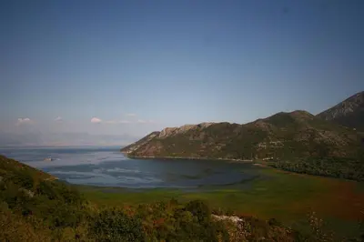 a view of a large body of water with mountains at Ivan's Holiday Home in Virpazar