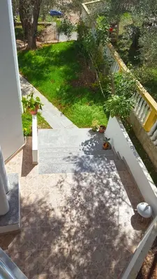 a view of a garden from the balcony of a house at Apartments Sirena in Ulcinj