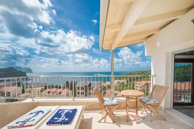 a balcony with a view of the ocean at Medin Apartments BluVista in Petrovac na Moru