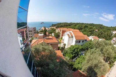 a view from a window of a city with houses at Medin Apartments BluVista in Petrovac na Moru
