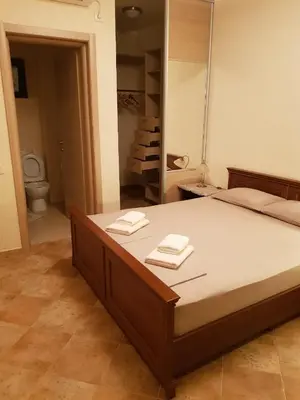 a bedroom with a bed with two towels on it at Villa 