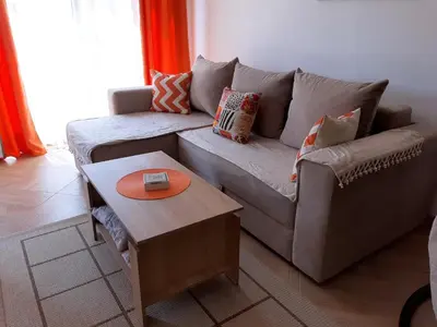 a living room with a couch and a table at Apartments Maljevic in Bar