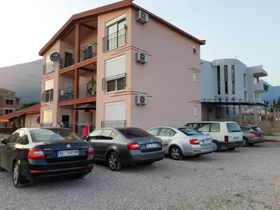 a group of cars parked in front of a building at Apartments Maljevic in Bar