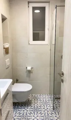 a bathroom with a toilet and a glass shower at VilaA21 in Bar