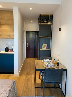 a dining room and kitchen with a table and chairs at VilaA21 in Bar