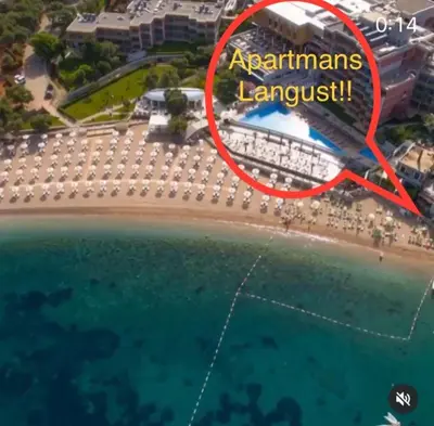 an aerial view of a beach with a sign that reads apartments lanlords largest at Apartments PROVA in Sveti Stefan