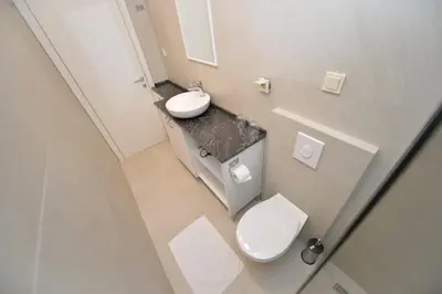 an overhead view of a bathroom with a toilet and sink at Apartments PROVA in Sveti Stefan