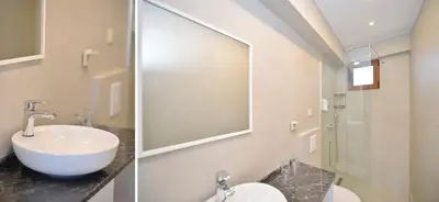 a bathroom with a sink and a mirror at Apartments PROVA in Sveti Stefan