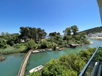 a view of a river with boats on it at Apartments Cungu in Ulcinj