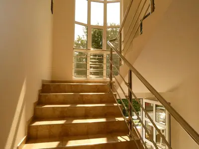 a staircase with a large window in a building at Apartments In Amor in Ulcinj