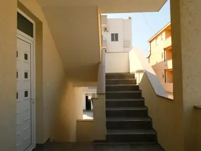 a staircase leading up to a building with a window at Apartments In Amor in Ulcinj