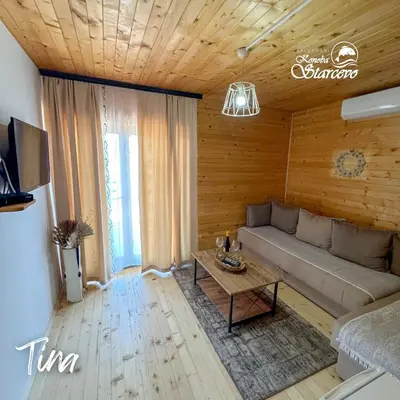 a living room with a couch and a table at Apartmani Konoba Starčevo in Virpazar