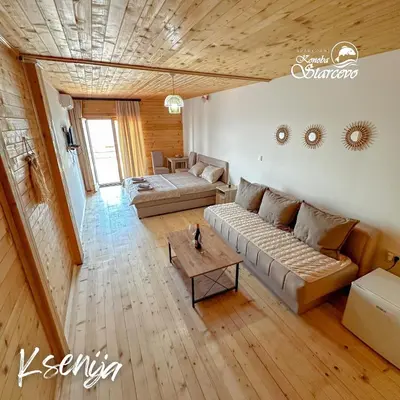 a living room with a couch and a table at Apartmani Konoba Starčevo in Virpazar