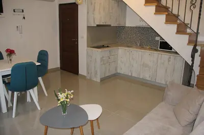 a living room with a couch and a table at Filipa Apartment in Kotor