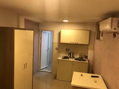 a small kitchen with a sink and a counter at Vip Apartmani Canj in Čanj