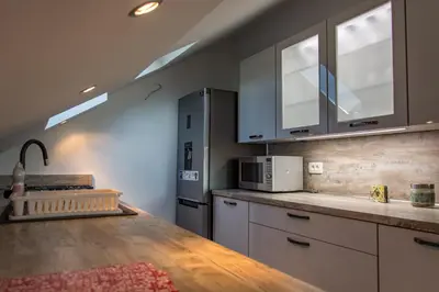 a kitchen with a counter top and a microwave at Apartmani Mendula in Budva