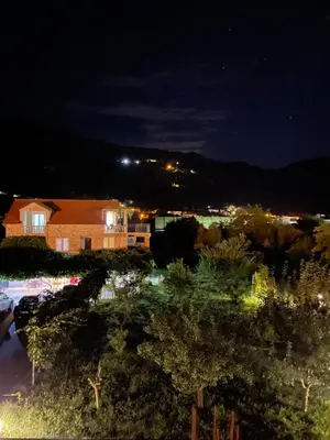 a view from the roof of a house at night at Apartmani Mendula in Budva