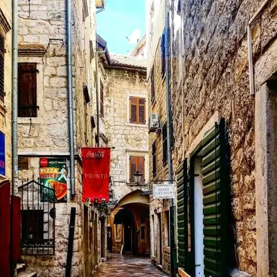 an alley between two buildings in an old town at Old town Kotor Square in Kotor