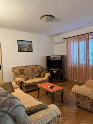 a living room with two couches and a coffee table at Apartmani Dada in Kotor