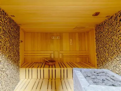 an empty wooden room with a bed in it at Luxury Apartments Tre Canne Can in Budva