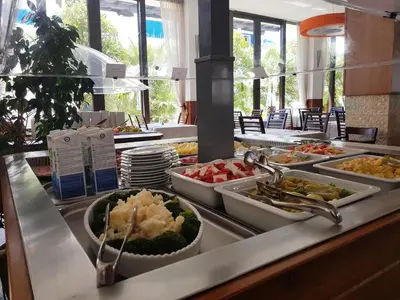 a buffet line with many different types of food at Hotel Aleksandar in Budva