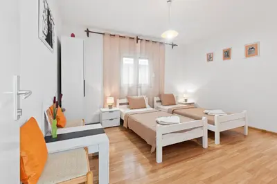 a living room with two beds and a couch at Apartments Casa Mia in Kotor